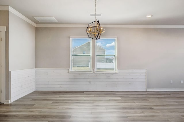 1010 Baltusrol Ln, Lebanon, TN 37087 - unfurnished dining area with crown molding, a notable chandelier, visible vents, and wood finished floors