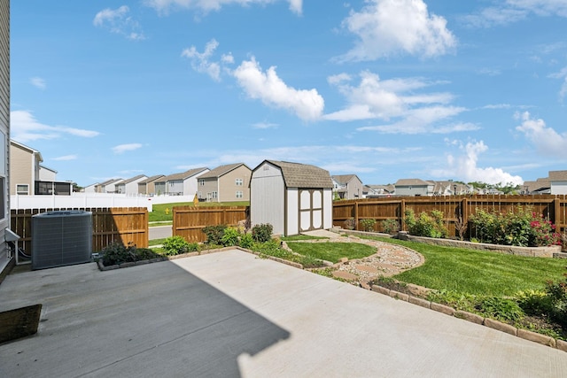 1010 Baltusrol Ln, Lebanon, TN 37087 - view of patio featuring a storage shed, cooling unit, a residential view, and an outbuilding