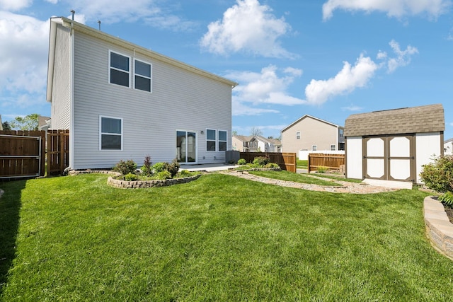 1010 Baltusrol Ln, Lebanon, TN 37087 - rear view of house featuring central air condition unit, a storage shed, a fenced backyard, a lawn, and an outdoor structure