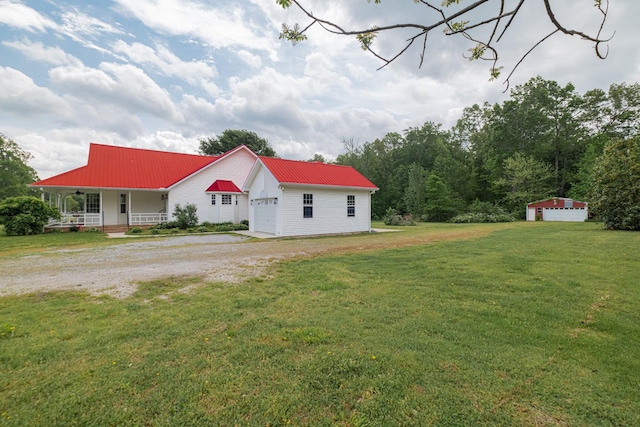 160 Robert E Lee Dr, Manchester, TN 37355 - exterior space with an attached garage, a porch, a front yard, driveway, and metal roof