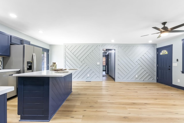 kitchen with ceiling fan, light wood-type flooring, light countertops, stainless steel appliances, and recessed lighting