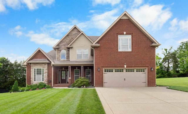 craftsman-style house featuring an attached garage, driveway, a front yard, stone siding, and brick siding