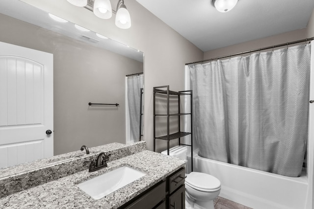 full bath featuring vanity, toilet, and shower / tub combo
