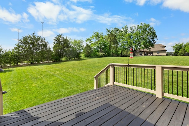 wooden deck featuring a yard