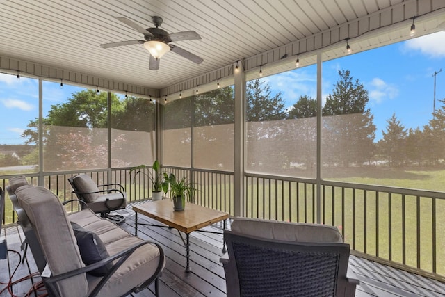 sunroom with a ceiling fan