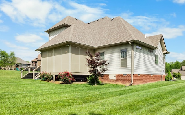 view of property exterior with a shingled roof, a lawn, and crawl space