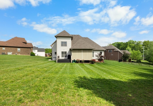 back of house with a yard