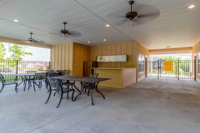 view of patio / terrace featuring outdoor dining area, a ceiling fan, and fence