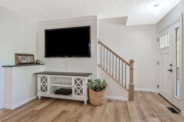 1780 Warren Hollow Rd, Nolensville, TN 37135 - foyer with light wood finished floors, a textured ceiling, stairs, and baseboards