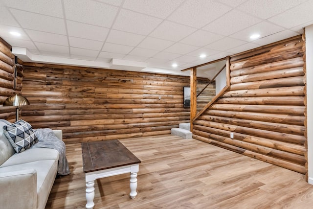 1780 Warren Hollow Rd, Nolensville, TN 37135 - living room with log walls, wood finished floors, stairs, a drop ceiling, and recessed lighting