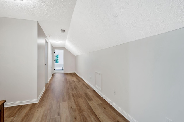 1780 Warren Hollow Rd, Nolensville, TN 37135 - bonus room featuring wood finished floors, a textured ceiling, baseboards, and vaulted ceiling