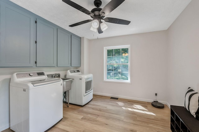 1780 Warren Hollow Rd, Nolensville, TN 37135 - laundry room featuring separate washer and dryer, cabinet space, baseboards, and light wood-type flooring