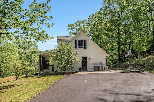 1780 Warren Hollow Rd, Nolensville, TN 37135 - view of front of house featuring a front lawn, a porch, driveway, and central AC