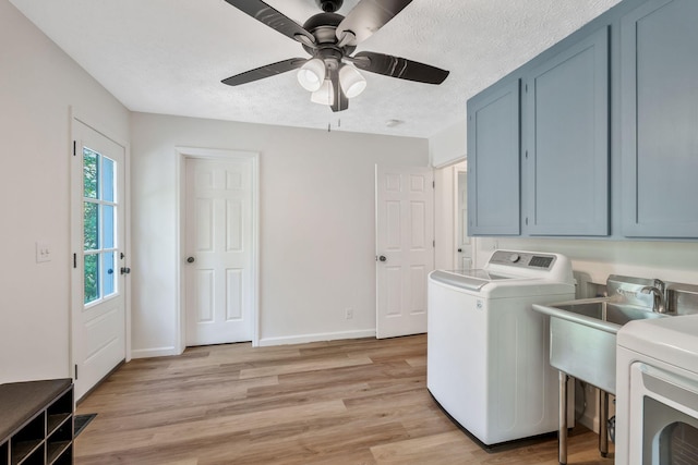 1780 Warren Hollow Rd, Nolensville, TN 37135 - laundry room with washer / dryer, cabinet space, light wood-style floors, ceiling fan, and a textured ceiling
