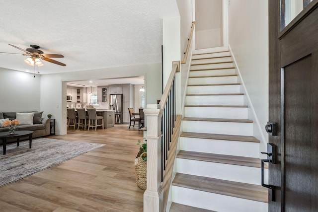 1780 Warren Hollow Rd, Nolensville, TN 37135 - stairway featuring ceiling fan, wood finished floors, and a textured ceiling