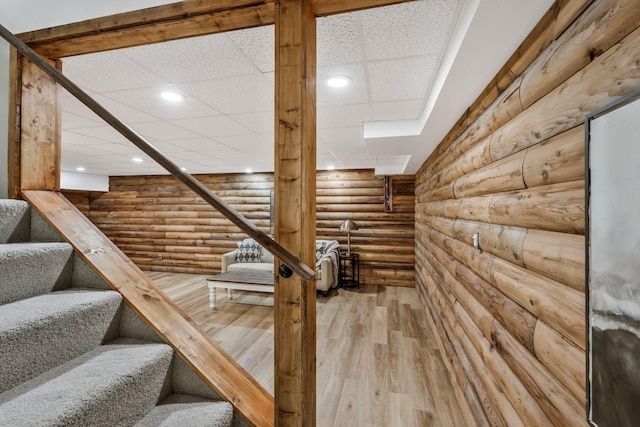 1780 Warren Hollow Rd, Nolensville, TN 37135 - stairs featuring rustic walls, wood finished floors, a paneled ceiling, and recessed lighting