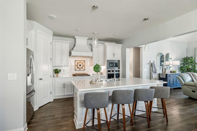 4015 John Marsh Rd, Spring Hill, TN 37174 - kitchen with a sink, stainless steel appliances, a breakfast bar, and custom exhaust hood