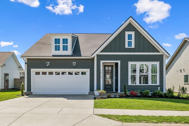 4015 John Marsh Rd, Spring Hill, TN 37174 - craftsman-style home with roof with shingles, board and batten siding, concrete driveway, and a front lawn