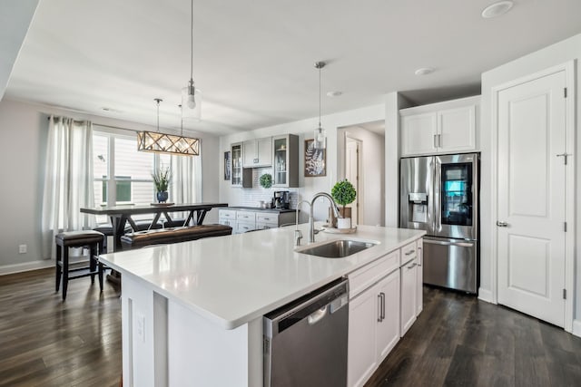 4015 John Marsh Rd, Spring Hill, TN 37174 - kitchen featuring a sink, dark wood-style flooring, glass insert cabinets, and stainless steel appliances