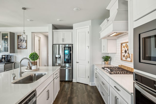 4015 John Marsh Rd, Spring Hill, TN 37174 - kitchen with a sink, light countertops, stainless steel appliances, decorative backsplash, and custom exhaust hood