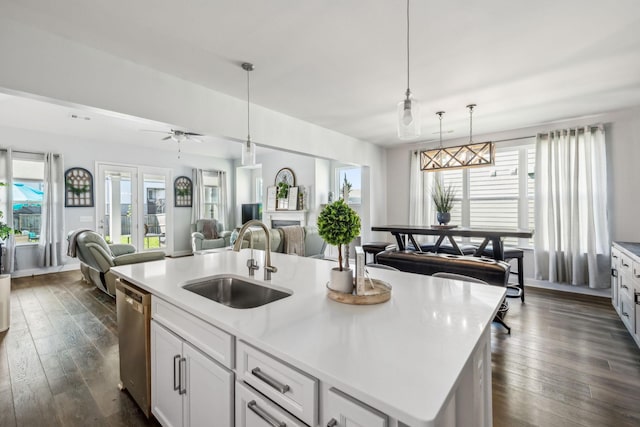 4015 John Marsh Rd, Spring Hill, TN 37174 - kitchen featuring a center island with sink, dishwasher, a sink, open floor plan, and dark wood-type flooring