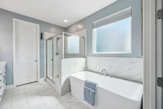 4015 John Marsh Rd, Spring Hill, TN 37174 - bathroom featuring a freestanding tub, a stall shower, vanity, baseboards, and marble finish floor