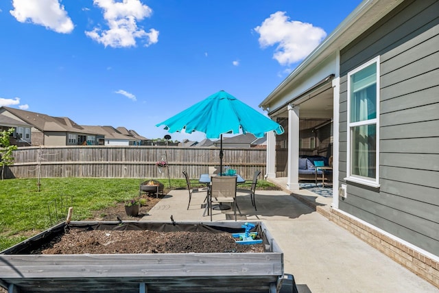 4015 John Marsh Rd, Spring Hill, TN 37174 - view of patio / terrace featuring fence private yard, a vegetable garden, and a residential view