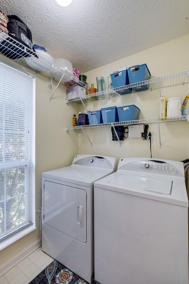 2510 Port Kembla Dr, Mount Juliet, TN 37122 - laundry room featuring separate washer and dryer, laundry area, a textured ceiling, and light tile patterned floors