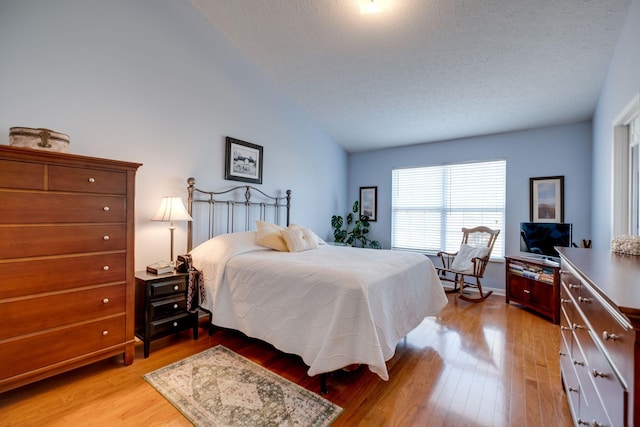 2510 Port Kembla Dr, Mount Juliet, TN 37122 - bedroom with a textured ceiling, light wood finished floors, and lofted ceiling
