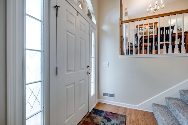 2510 Port Kembla Dr, Mount Juliet, TN 37122 - entrance foyer featuring baseboards, an inviting chandelier, plenty of natural light, and wood finished floors