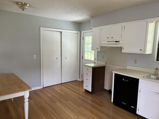 kitchen featuring black dishwasher, white cabinetry, under cabinet range hood, and wood finished floors