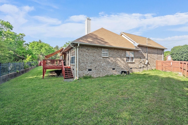 rear view of house featuring stairs, a fenced backyard, a wooden deck, and crawl space