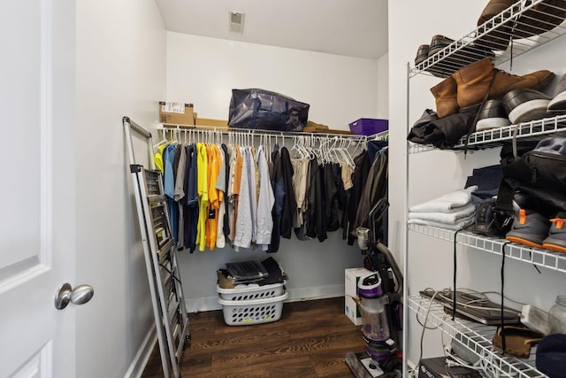 spacious closet featuring wood finished floors and visible vents