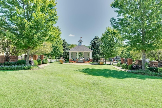 view of yard featuring a gazebo and fence