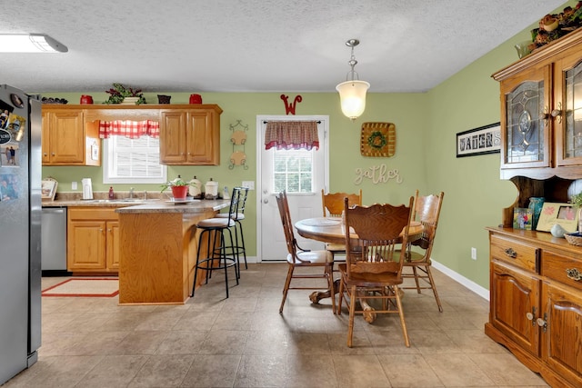 110 Broomsage Cir, Unionville, TN 37180 - dining room featuring light tile patterned flooring, a textured ceiling, and baseboards