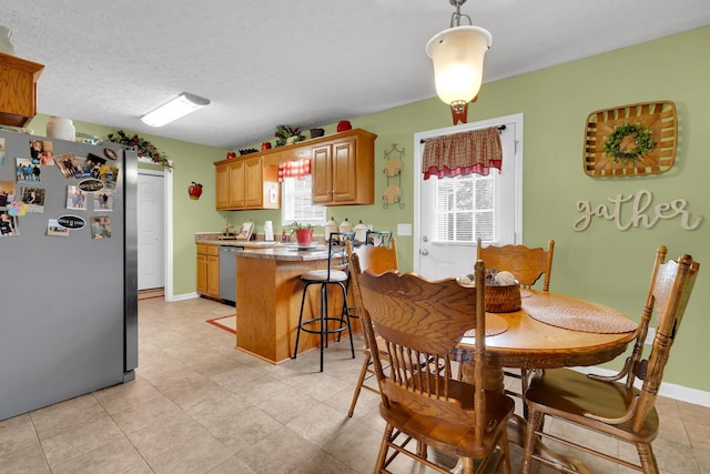 110 Broomsage Cir, Unionville, TN 37180 - dining area featuring baseboards, a textured ceiling, and light tile patterned floors