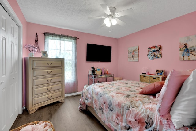 110 Broomsage Cir, Unionville, TN 37180 - bedroom with a textured ceiling, ceiling fan, a closet, and wood finished floors