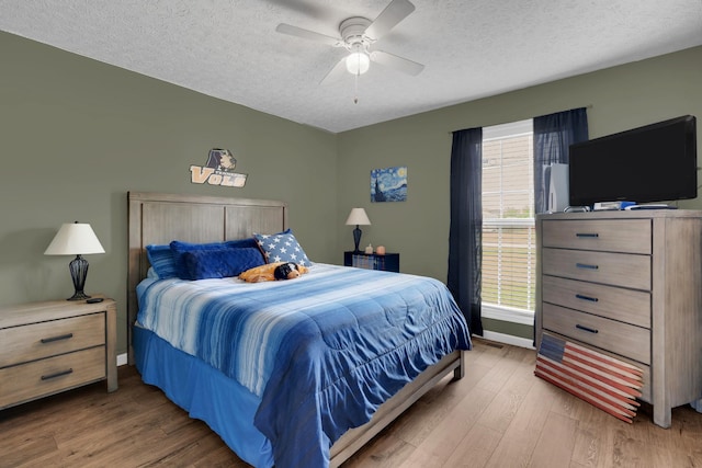 110 Broomsage Cir, Unionville, TN 37180 - bedroom featuring a textured ceiling, baseboards, a ceiling fan, and wood finished floors