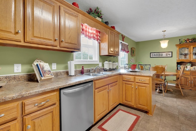 110 Broomsage Cir, Unionville, TN 37180 - kitchen with pendant lighting, stainless steel dishwasher, a sink, light tile patterned floors, and a peninsula