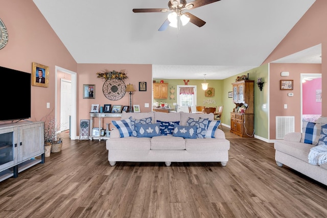 110 Broomsage Cir, Unionville, TN 37180 - living area featuring visible vents, wood finished floors, baseboards, ceiling fan, and vaulted ceiling