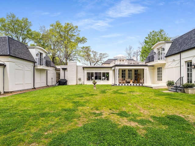 305 Davidson Rd, Nashville, TN 37205 - rear view of property with stucco siding, a yard, and mansard roof