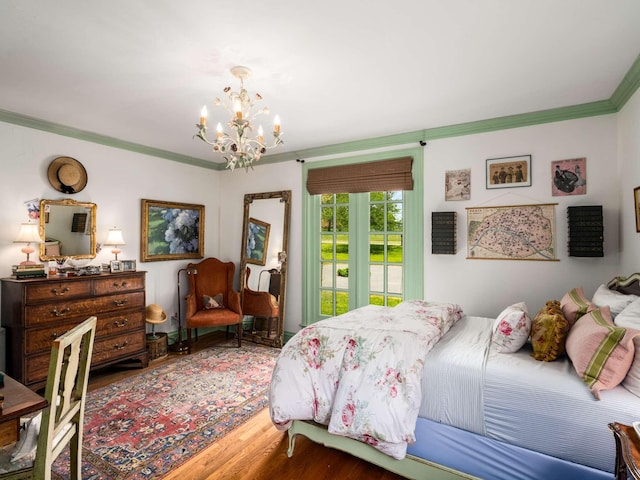 305 Davidson Rd, Nashville, TN 37205 - bedroom featuring ornamental molding, a chandelier, access to exterior, and wood finished floors