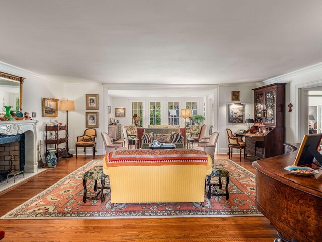 305 Davidson Rd, Nashville, TN 37205 - living room with crown molding, baseboards, wood finished floors, and a fireplace
