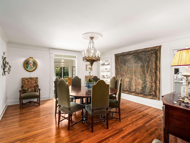305 Davidson Rd, Nashville, TN 37205 - dining room with crown molding, wood finished floors, and an inviting chandelier
