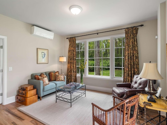 305 Davidson Rd, Nashville, TN 37205 - living area featuring wood finished floors, baseboards, and a wall mounted AC