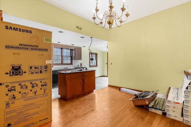 5506 Lickton Pike, Goodlettsville, TN 37072 - kitchen featuring visible vents, brown cabinetry, light wood finished floors, and a notable chandelier