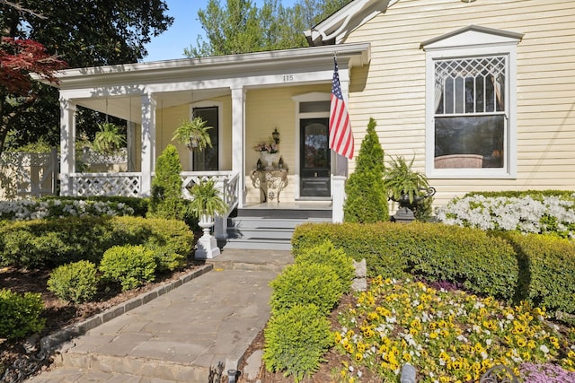 doorway to property featuring a porch