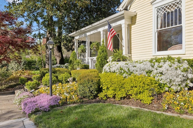 view of side of property featuring a porch