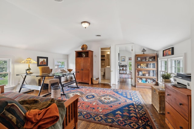 living room with plenty of natural light, wood finished floors, and lofted ceiling