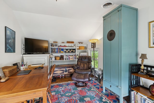 interior space with vaulted ceiling and visible vents